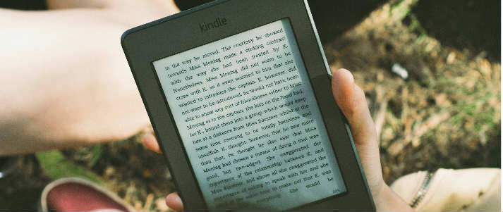 person holding kindle ereader