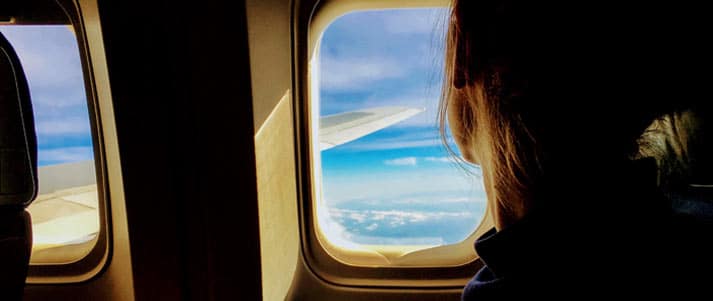 person looking out of an airplane window