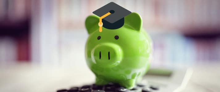 piggy bank wearing graduation cap